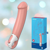 A Satisfyer Vibes Master XXL G-Spot Vibrating Dildo in pink makes a striking contrast against a gentle pastel backdrop, alongside its chic packaging that prominently features the Satisfyer brand and promises outstanding G-spot pleasure.